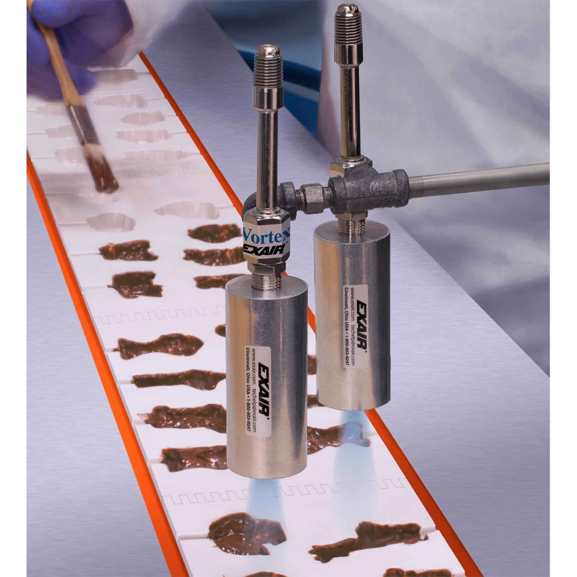 Exair - Vortex Tubes Exair Vortex Tubes setting chocolate on a production line.